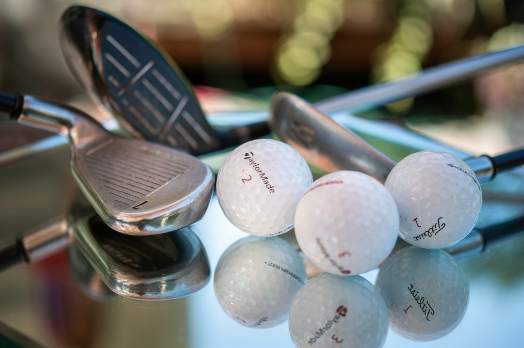 Golf clubs and golf balls. Tee time.